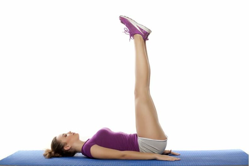 doing exercises by raising the legs with a load